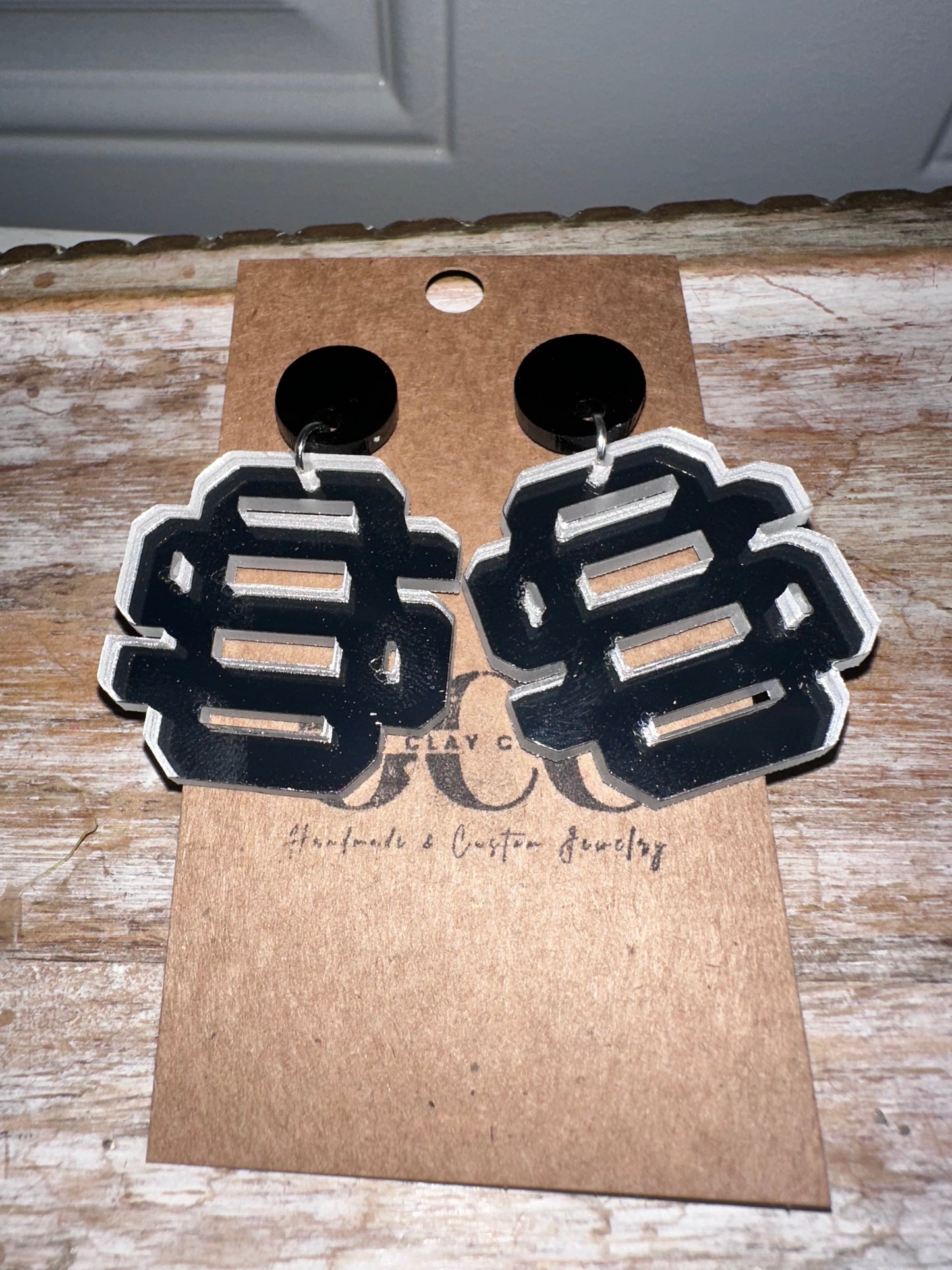 Os Logo Silver Mirror Acrylic Earrings- black topper