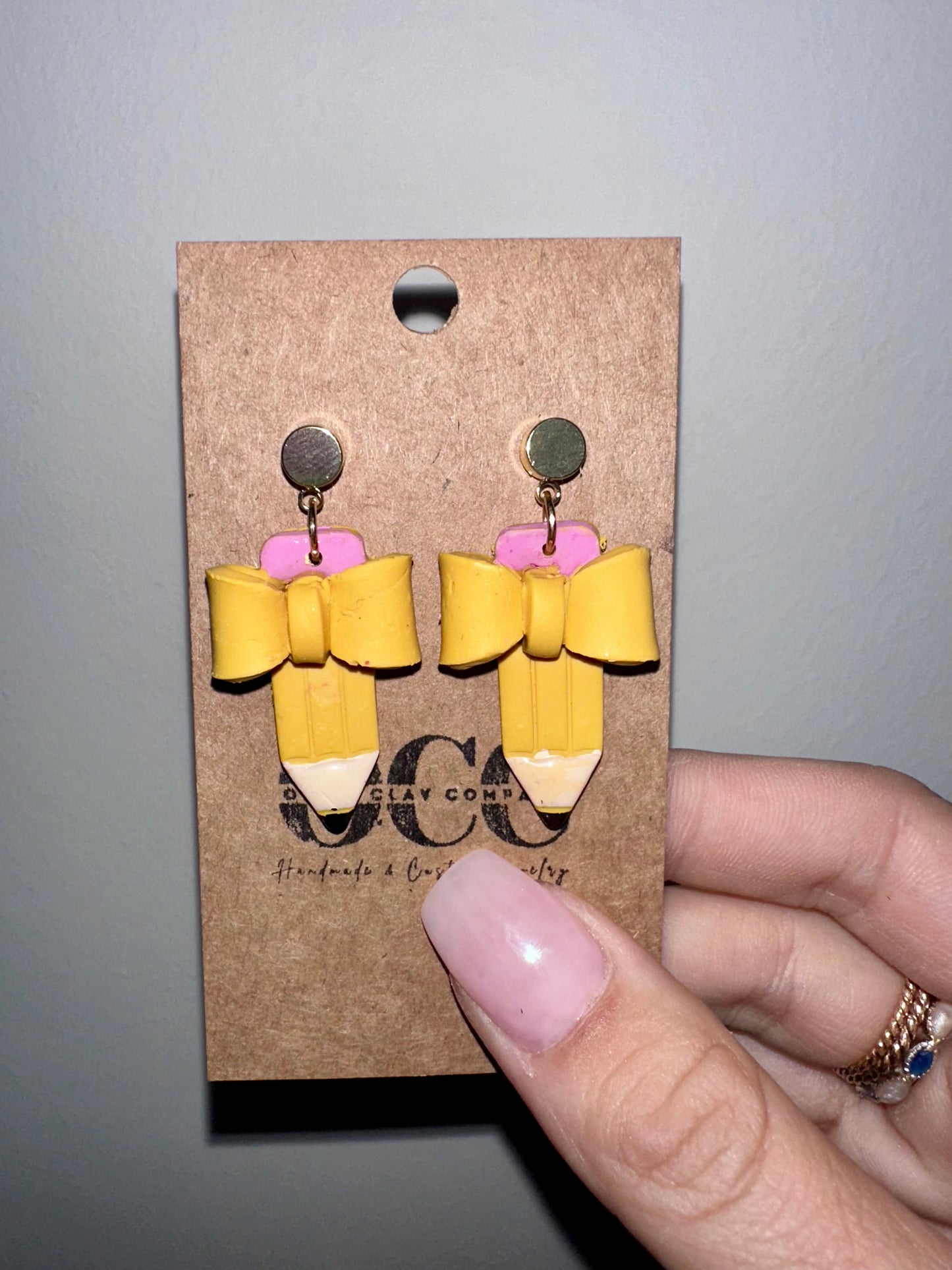 Bow pencil earrings