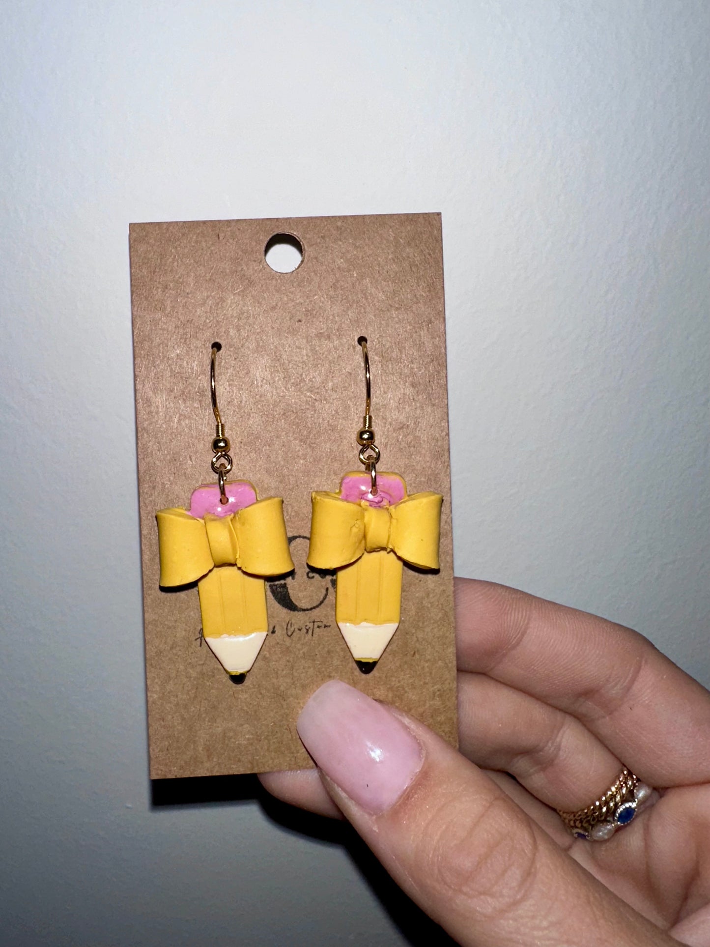 Bow pencil earrings