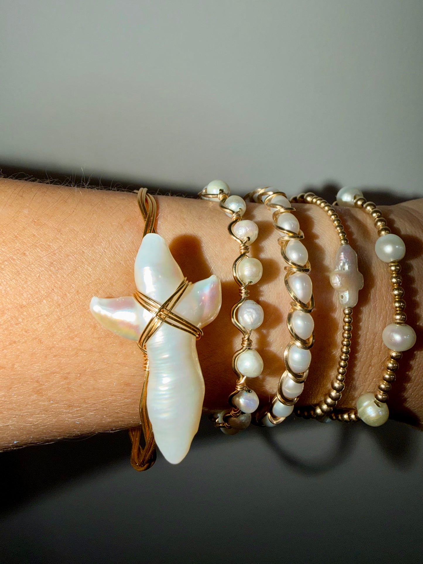 Large freshwater pearl cross gold plated wire bracelet