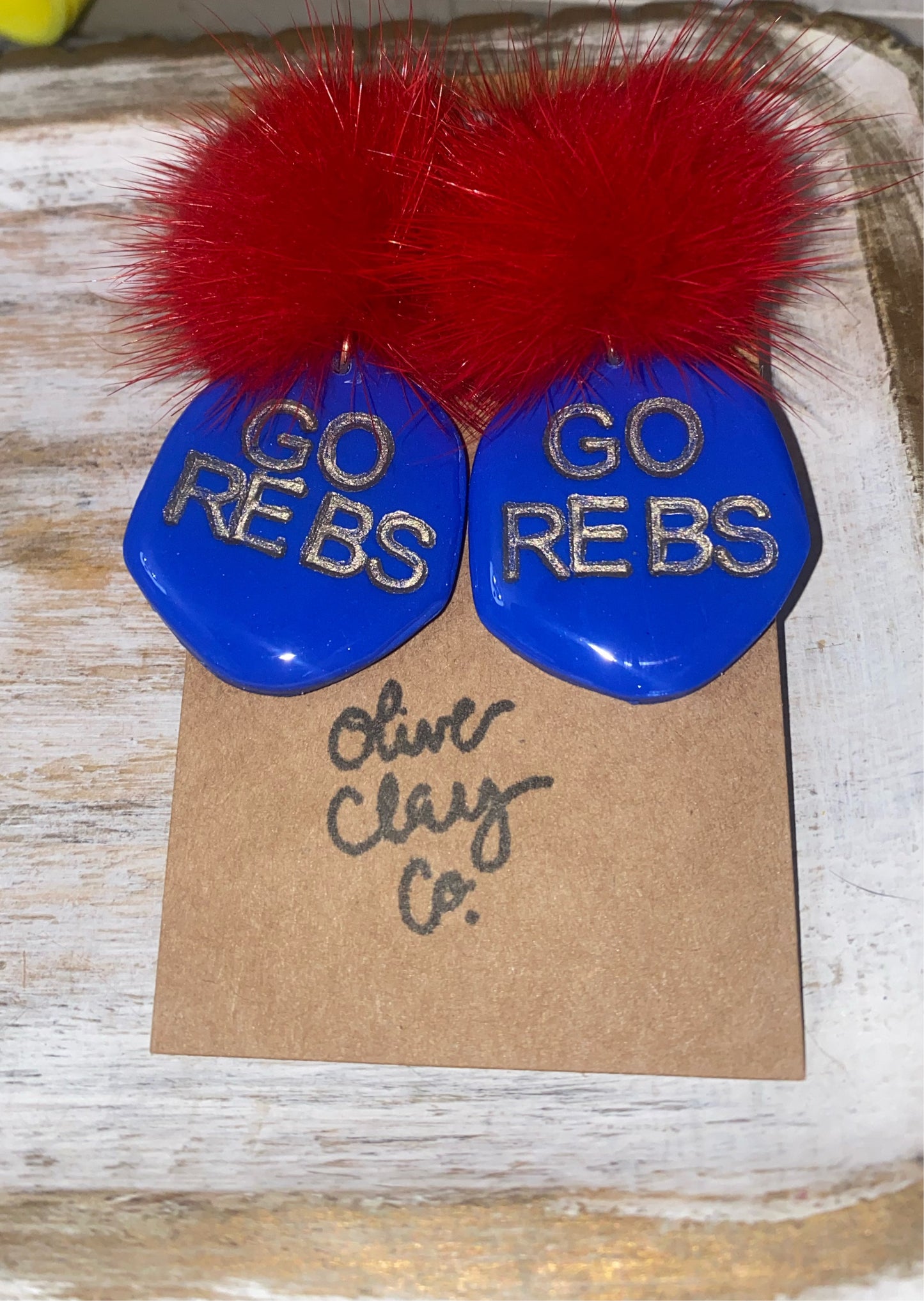 Go Rebs Pom Earrings
