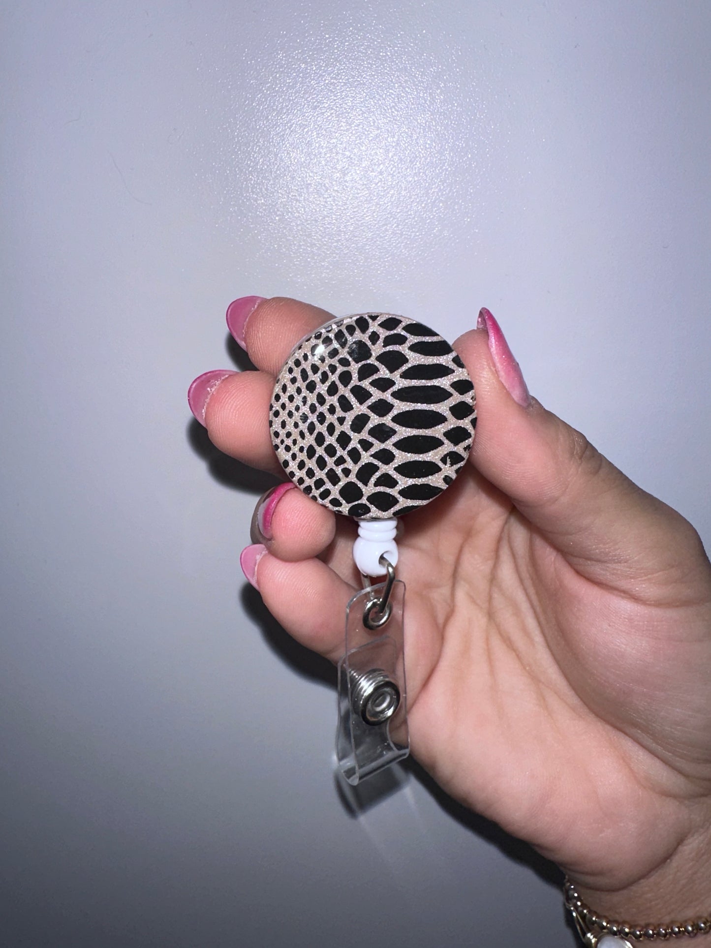 Badge reel with alligator clip